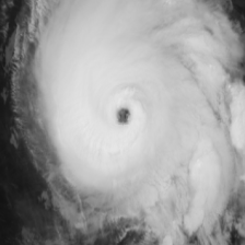Infrared satellite frame showing a symmetric hurricane with a small clear eye.